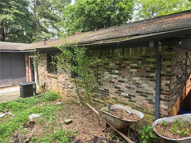 1203 Balboa Ct, Norcross, GA 30093 - view of side of home with central air condition unit and brick siding