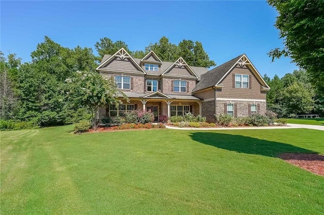 craftsman-style house with a front lawn