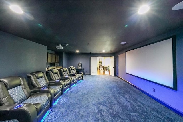 cinema room with carpet and baseboards