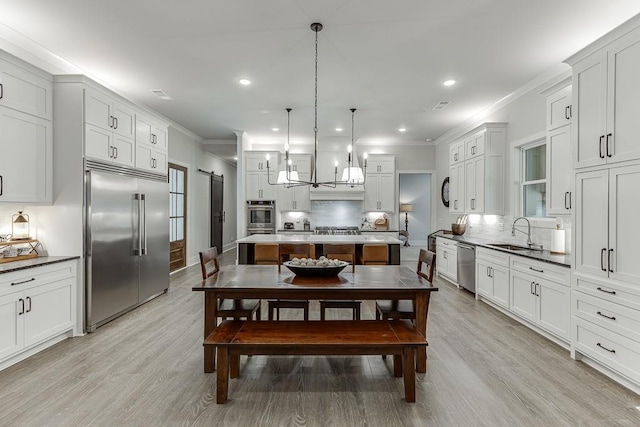 1889 Jefferson River Rd, Jefferson, GA 30549 - kitchen with appliances with stainless steel finishes, backsplash, crown molding, light wood-type flooring, and recessed lighting