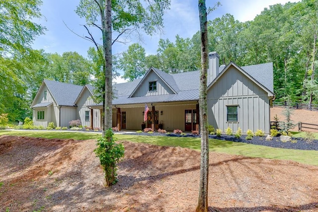 1889 Jefferson River Rd, Jefferson, GA 30549 - modern inspired farmhouse featuring board and batten siding, a chimney, and a shingled roof