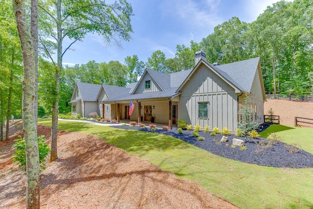 1889 Jefferson River Rd, Jefferson, GA 30549 - modern farmhouse featuring board and batten siding, a chimney, and roof with shingles