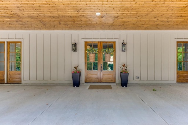 1889 Jefferson River Rd, Jefferson, GA 30549 - view of exterior entry featuring french doors and board and batten siding