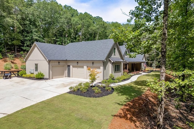 1889 Jefferson River Rd, Jefferson, GA 30549 - modern farmhouse style home featuring roof with shingles, a front yard, concrete driveway, and a garage