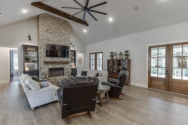 1889 Jefferson River Rd, Jefferson, GA 30549 - living room with french doors, high vaulted ceiling, wood finished floors, beam ceiling, and a fireplace