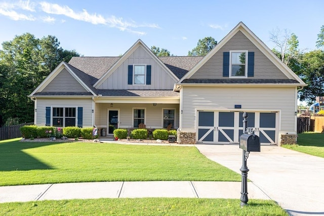 386 Summersong Pl, Talmo, GA 30575 - craftsman-style home with driveway, board and batten siding, covered porch, and a garage