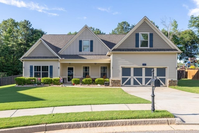 386 Summersong Pl, Talmo, GA 30575 - craftsman-style home with concrete driveway, board and batten siding, covered porch, roof with shingles, and an attached garage