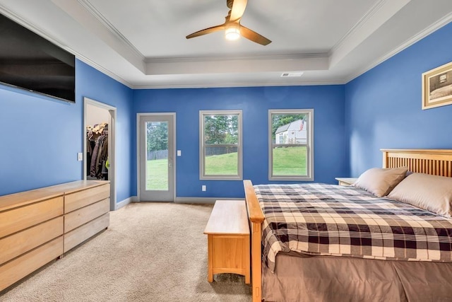 386 Summersong Pl, Talmo, GA 30575 - carpeted bedroom featuring a tray ceiling, multiple windows, crown molding, access to outside, and ceiling fan