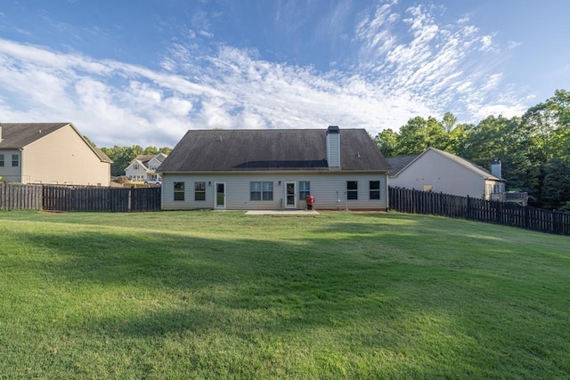 386 Summersong Pl, Talmo, GA 30575 - rear view of house with a fenced backyard, a chimney, and a patio area