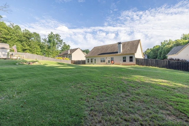 386 Summersong Pl, Talmo, GA 30575 - back of house featuring a chimney and a fenced backyard