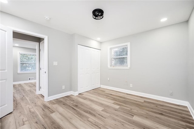 2198 Star Mist Dr SW, Atlanta, GA 30311 - unfurnished bedroom with light wood finished floors and a closet