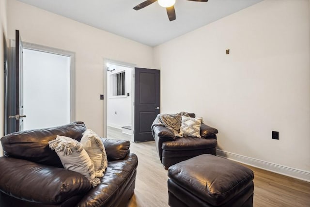7994 Devonshire Dr, Jonesboro, GA 30238 - living room with a ceiling fan, light wood finished floors, and baseboards