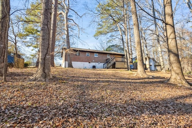 7994 Devonshire Dr, Jonesboro, GA 30238 - rear view of house featuring stairway and a wooden deck