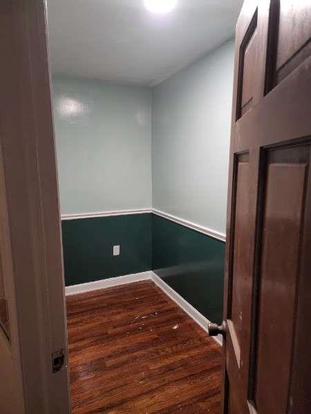empty room featuring baseboards and wood finished floors