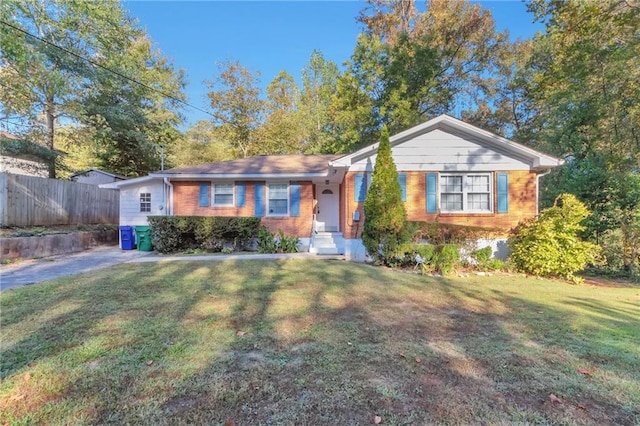 ranch-style home with a front lawn