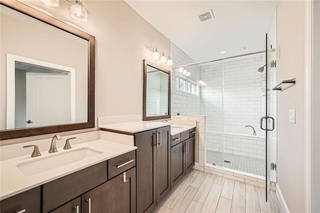 504 E Howard Ave, Decatur, GA 30030 - bathroom featuring two vanities and a shower stall