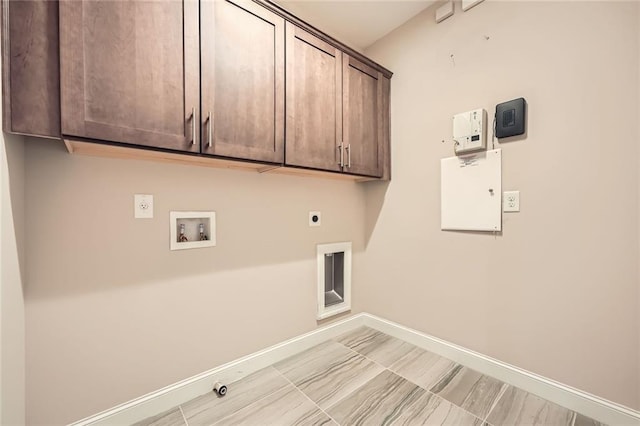 504 E Howard Ave, Decatur, GA 30030 - laundry area with cabinet space, hookup for an electric dryer, and hookup for a washing machine