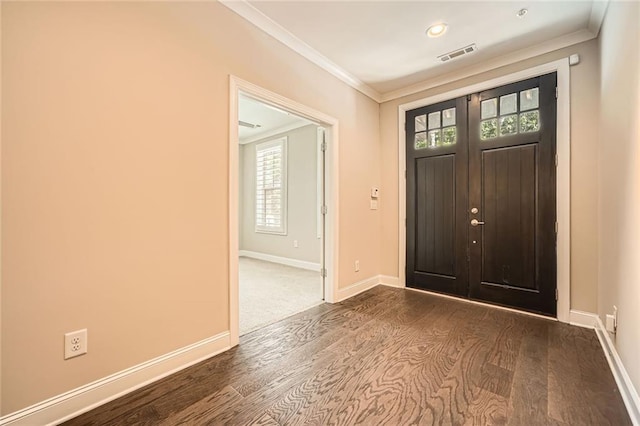 504 E Howard Ave, Decatur, GA 30030 - foyer featuring dark wood-style flooring, healthy amount of natural light, and ornamental molding