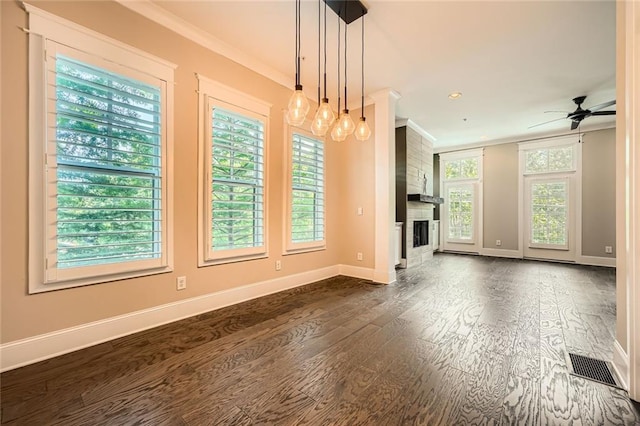 504 E Howard Ave, Decatur, GA 30030 - unfurnished living room with ornamental molding, dark wood-style floors, a ceiling fan, a large fireplace, and recessed lighting