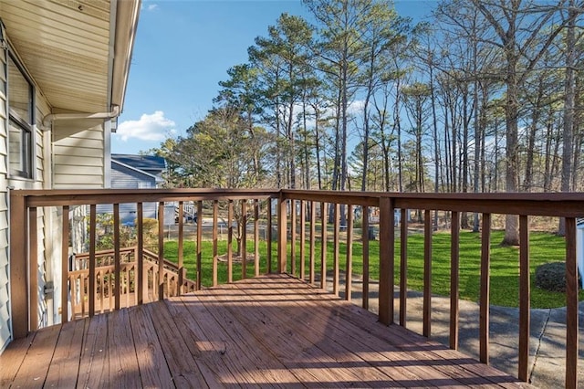 wooden terrace with a yard