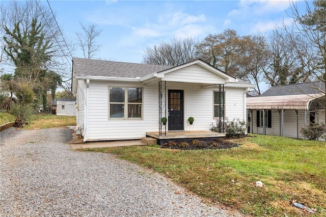 view of front facade with a front lawn and a porch