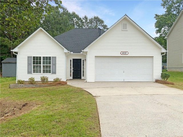 ranch-style home with a front lawn and a garage