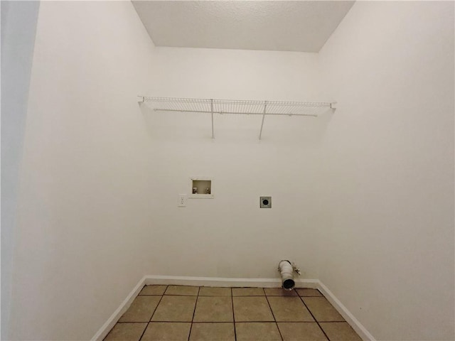 laundry room with washer hookup, hookup for an electric dryer, and light tile patterned flooring