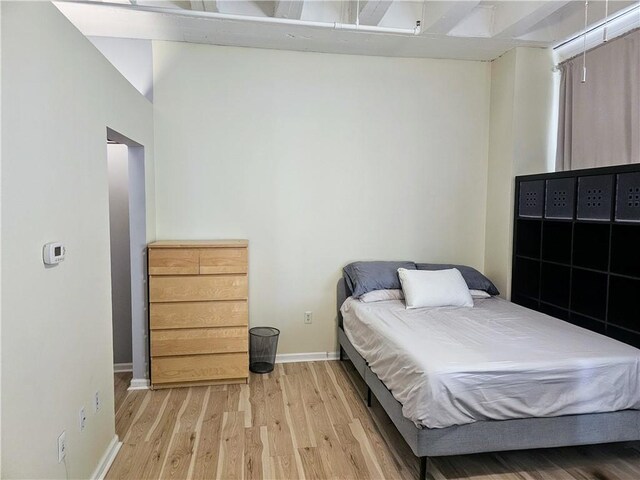 bedroom with hardwood / wood-style floors