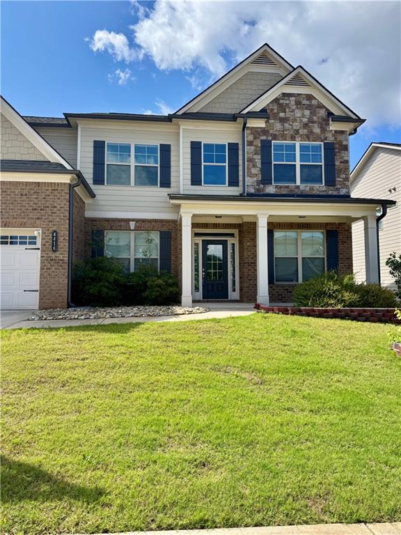4416 Birch Meadow Trl, Gainesville, GA 30504 - view of front of property with a front lawn, brick siding, and a garage