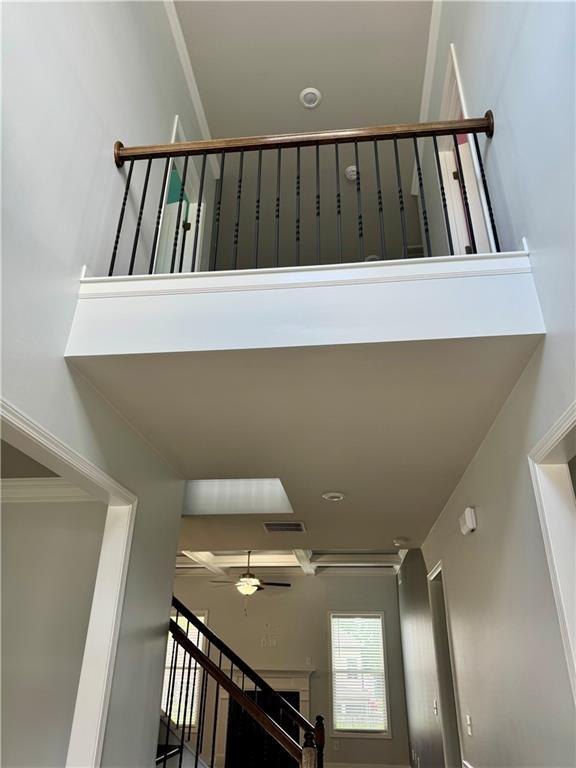 4416 Birch Meadow Trl, Gainesville, GA 30504 - stairs with ceiling fan, ornamental molding, and a towering ceiling