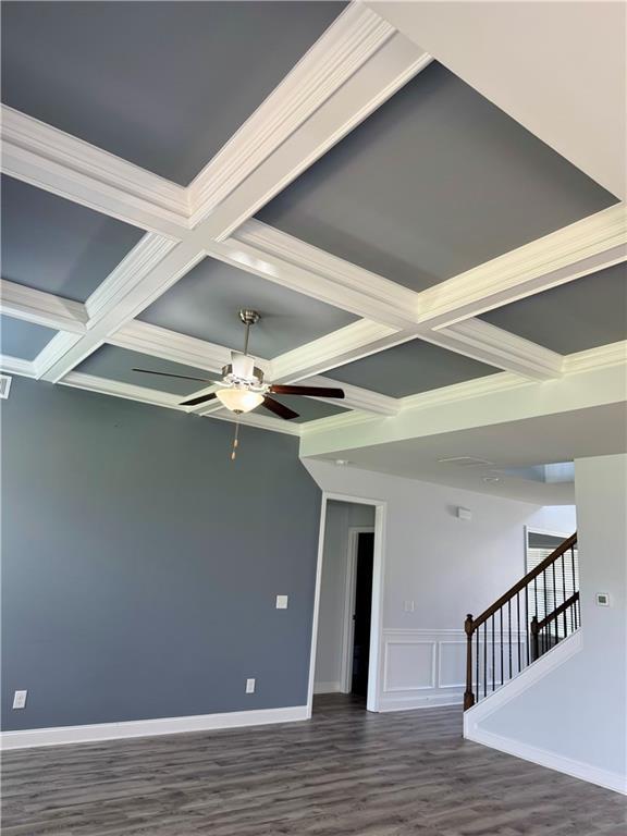 4416 Birch Meadow Trl, Gainesville, GA 30504 - spare room with coffered ceiling, beamed ceiling, a ceiling fan, wood finished floors, and stairway