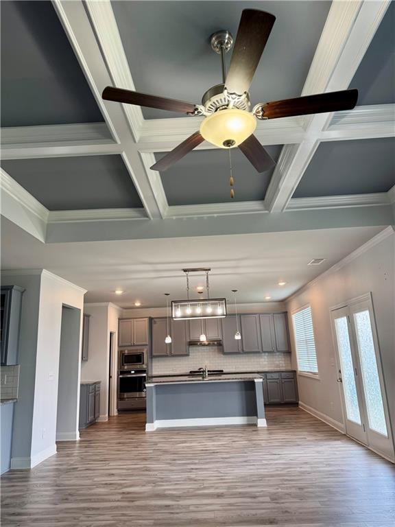 4416 Birch Meadow Trl, Gainesville, GA 30504 - kitchen featuring appliances with stainless steel finishes, gray cabinets, backsplash, coffered ceiling, and ornamental molding