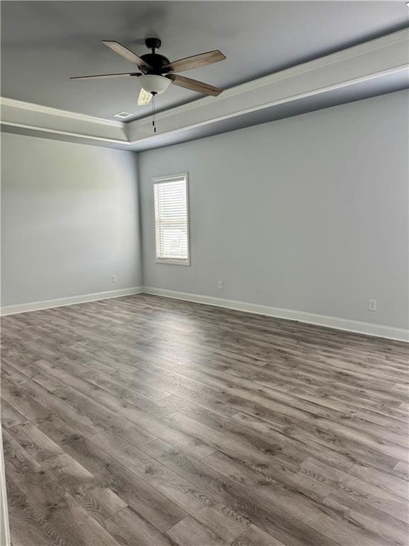 4416 Birch Meadow Trl, Gainesville, GA 30504 - empty room with wood finished floors, a raised ceiling, baseboards, and ceiling fan