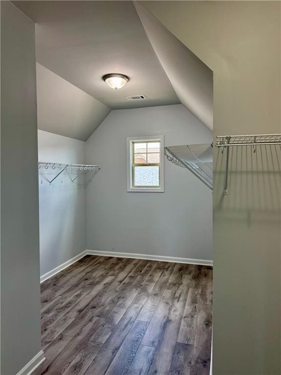 4416 Birch Meadow Trl, Gainesville, GA 30504 - spacious closet featuring wood finished floors and vaulted ceiling