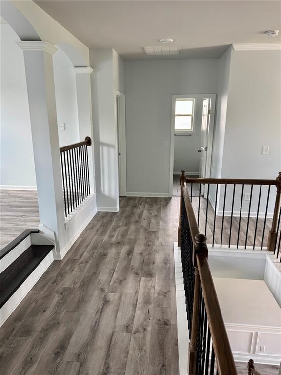 4416 Birch Meadow Trl, Gainesville, GA 30504 - hallway with an upstairs landing, wood finished floors, and baseboards