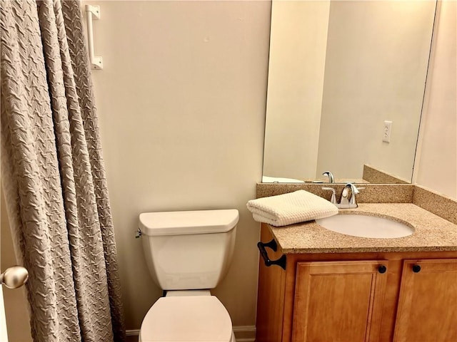 full bath with toilet and vanity