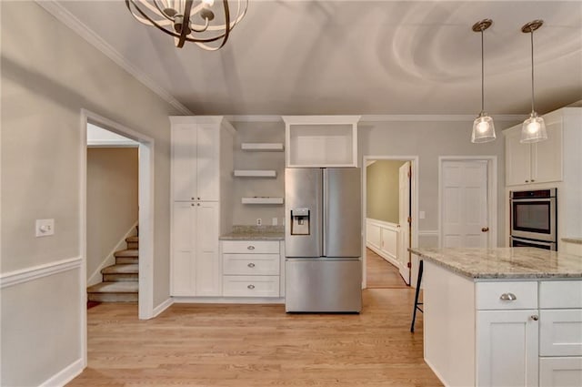 kitchen featuring light hardwood / wood-style floors, white cabinetry, and stainless steel appliances