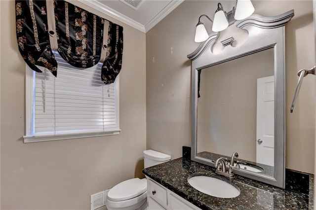 bathroom with crown molding, vanity, and toilet