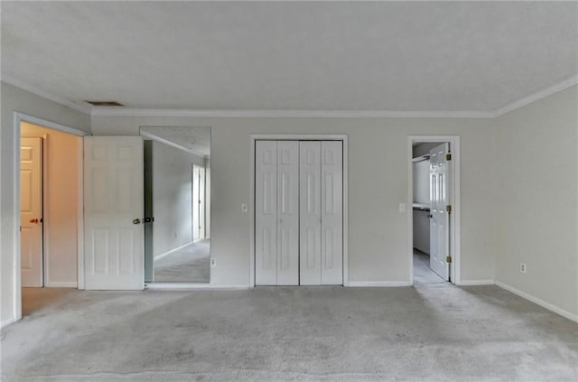 unfurnished bedroom featuring light carpet and crown molding