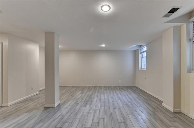 basement featuring light hardwood / wood-style floors