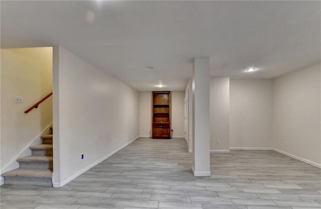 basement featuring light hardwood / wood-style floors