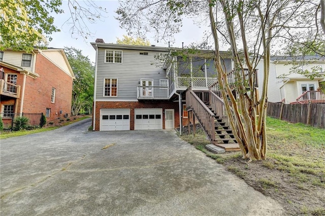 back of property featuring a garage