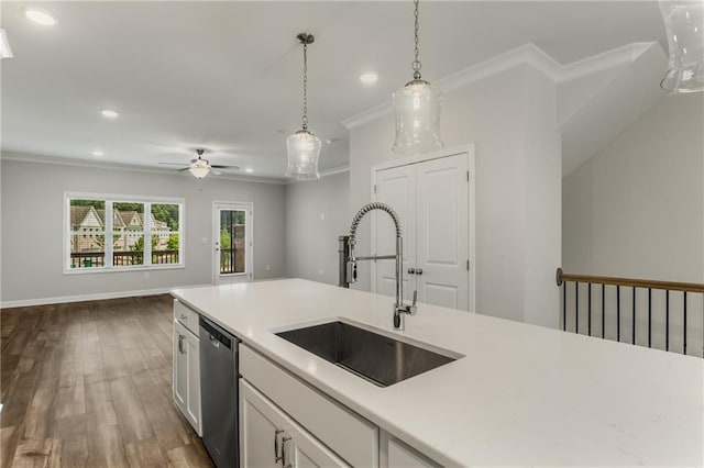 kitchen featuring sink, white cabinetry, dishwasher, and crown molding