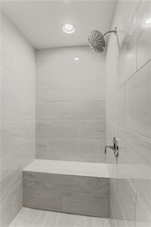 bathroom with tiled shower