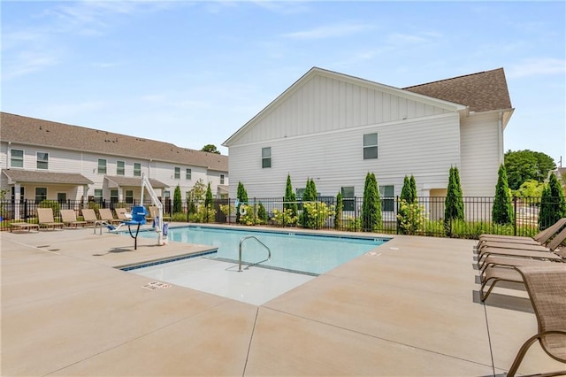 view of swimming pool with a patio