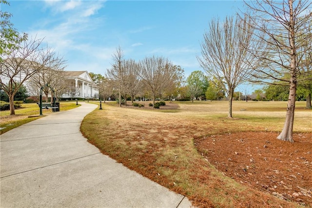 view of home's community with a lawn