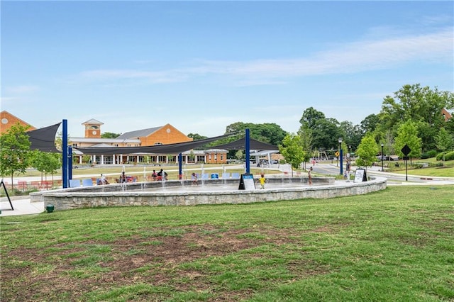 view of property's community featuring a yard