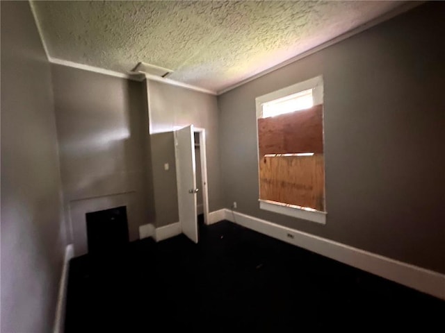29 Ivy St, Porterdale, GA 30014 - unfurnished room with a textured ceiling and crown molding