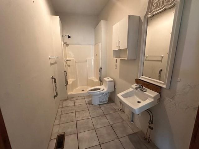 29 Ivy St, Porterdale, GA 30014 - full bathroom featuring a sink, a shower stall, tile patterned flooring, and toilet