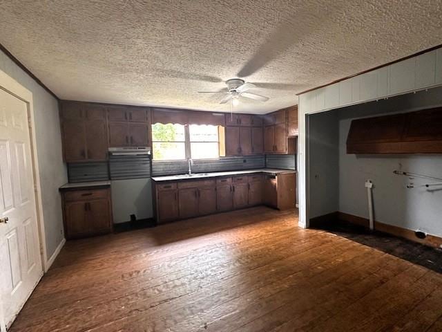 29 Ivy St, Porterdale, GA 30014 - kitchen featuring a ceiling fan, fridge, dark wood-style floors, a sink, and a textured ceiling